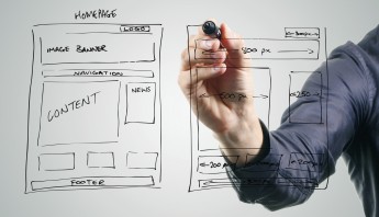 designer drawing website development wireframe